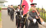 2012 Memorial Service - Officers with flags marching to memorial service