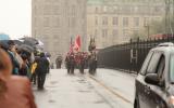 2012 Memorial Service - Officers with flags marching in front of onlookers