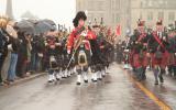 2012 Memorial Service - Officers with bagpipes marching in front of onlookers (4)