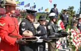 2013 Memorial Service - Officers presenting memorial items at attention